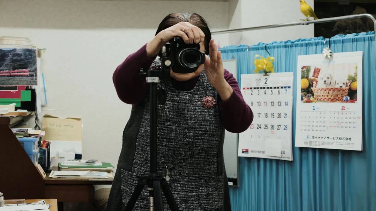 Masao Adachi Takes a Passport Photo